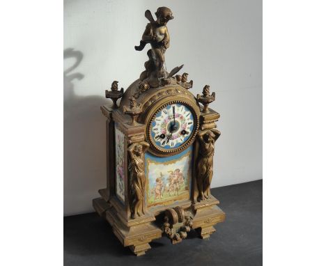 A 19th century gilt-metal eight-day mantle clock with&nbsp;Sèvres-style porcelain panels decorated with cherubic figures and 