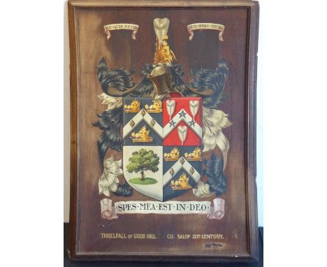 A framed oak panel depicting the 'Threlfall of Grug Hill' (Co. Salop 20th century) coat of arms (frame size 57cm x 41cm)