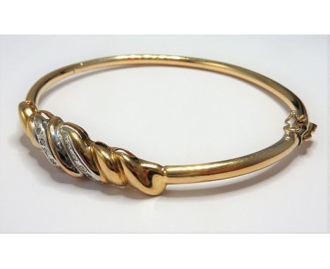 A 9-carat gold and diamond bangle (total weight approx. 8.58g)&nbsp;(The cost of&nbsp;UK postage&nbsp;via Royal Mail Special 