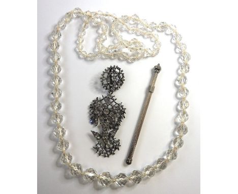 A George III colourless paste openwork St Esprit pendant in three detachable sections, a silver swizzle stick and a crystal b