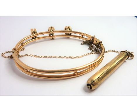 A Victorian yellow-gold pencil hinged bangle, the two bands conjoined at the top with a detachable propelling pencil (gross w