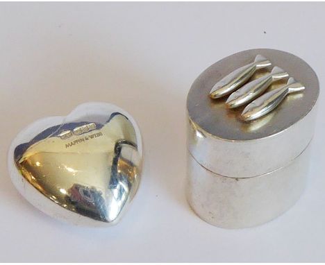 A heavy solid hallmarked silver heart by Mappin &amp; Webb, London 1991, together with a similar sized hallmarked silver oval