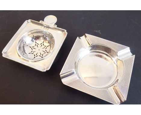 A hallmarked silver ashtray with engine-turned decoration together with a hallmarked silver early 20th century strainer of sq