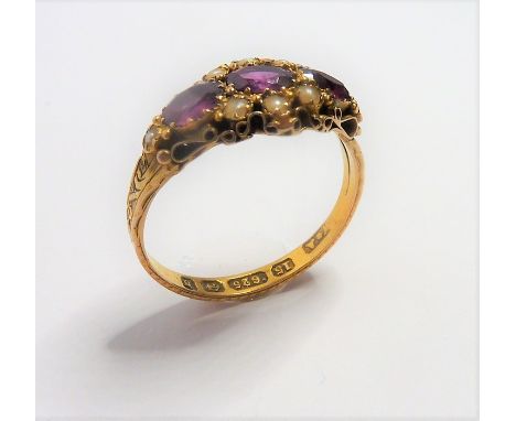 A mid-Victorian 15-carat yellow-gold pink gemstone and half pearl ring; the three oval mixed cut stones within an ornate appl