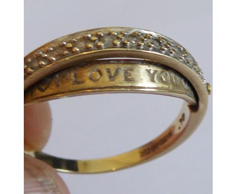 An unusual 9-carat yellow-gold ring horizontally mounted with ten small diamonds (.10) and with unusual front hinged insert r