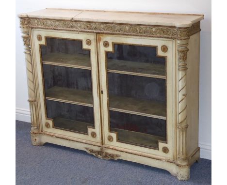 A 19th century marble-topped pier cabinet; two glazed doors below a gilt frieze decorated with scrolling foliage and flanked 