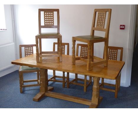 A fine Robert 'Mouseman' Thompson of Kilburn refectory dining table together with six lattice back chairs upholstered in brig