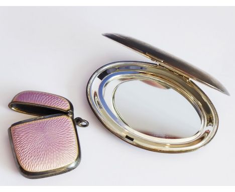 A late 19th/early 20th century silver (marked 925) and pink guilloche enamel vesta case together with a slightly larger oval 