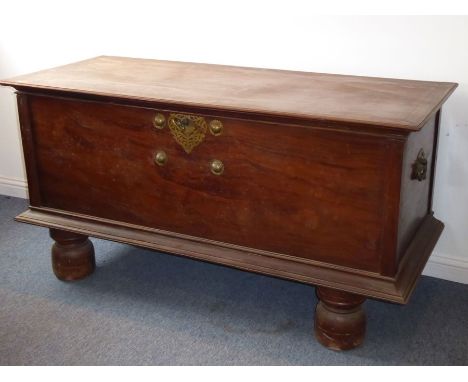 A fine and extremely large 19th century style later Anglo-Indian hardwood trunk; the hinged top with cleated ends and front a