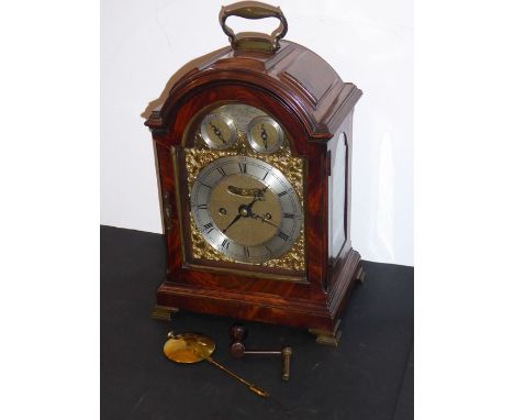 A fine 18th century figured mahogany-cased eight-day repeating bracket clock; the broken-arch dial having silvered chapter ri