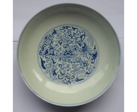 A circular Chinese porcelain blue-and-white dish; six-character mark of Daoguang and possibly of the period, the well finely 