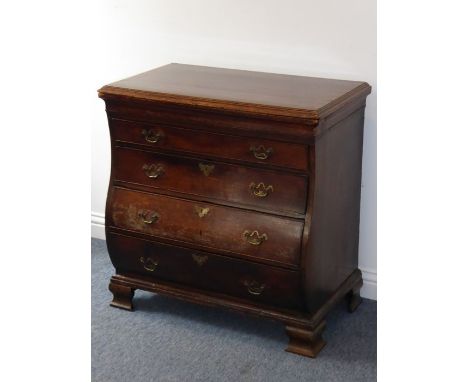 An early 19th century continental mahogany and cross-banded chest; the moulded top above a full-width 'secret' drawer, four f