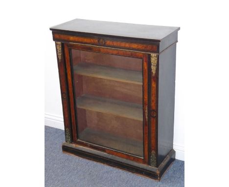 A 19th century ebonised, amboyna-banded and gilt-metal mounted pier cabinet, the slightly overhanging top above a frieze cent