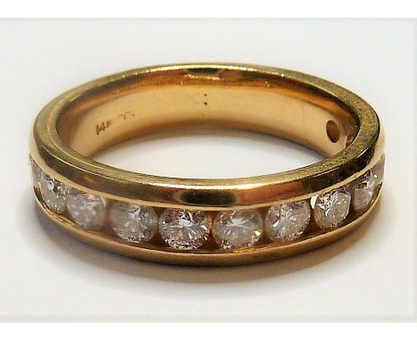 A 14-carat gold half eternity ring set with twelve fine white diamonds (The cost of&nbsp;UK postage&nbsp;via Royal Mail Speci