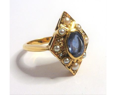 A sapphire, half-pearl and 18-carat yellow-gold dress ring of lozenge design; the central oval sapphire collet within the ope