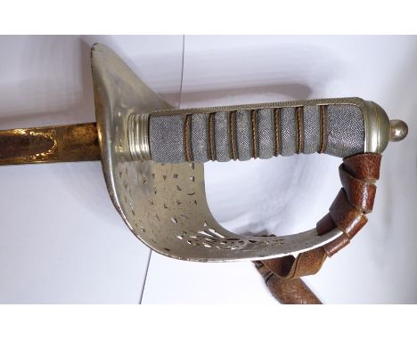 An 1897 Pattern officer's sword with brown-leather regulation scabbard, complete with brown-leather sword cover with the init