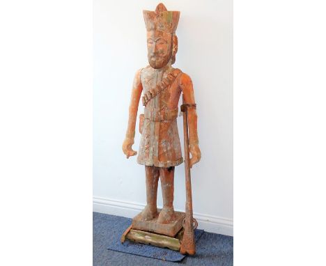 A fine, large and highly unusual carved wood (in faux terracotta style) model of a 19th century style Indian Rajput soldier w