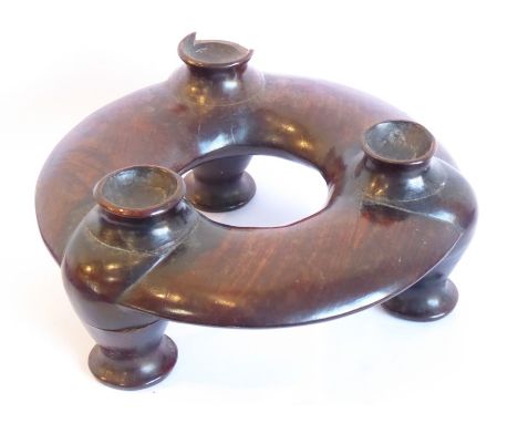 A late 19th/early 20th century Chinese heavy rosewood circular tripod censer stand (one support damaged) (18cm diameter x 8cm