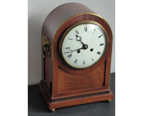 A 19th century mahogany and brass-inlaid eight-day bracket clock; white-enamel dial with Roman numerals above a brass inlay a