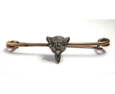 A 19th century diamond-set bar brooch, the fox's head in rose-cut diamonds and ruby eyes applied to the centre