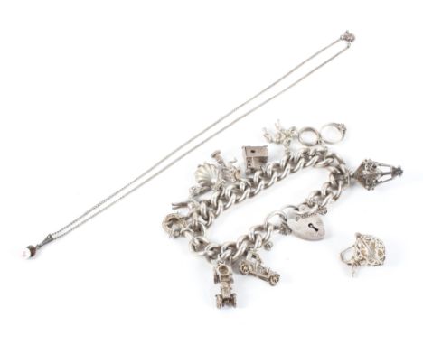 A large hallmarked sterling silver curb link bracelet with padlock and safety chain and eleven assorted charms (one is loose)