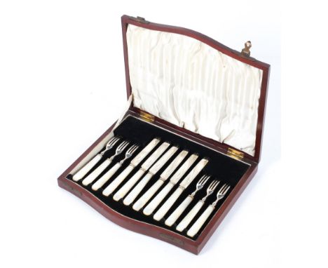 A canteen of six silver plated and mother of pearl mounted fruit knives and forks, early 20th century, in velvet lined hinged