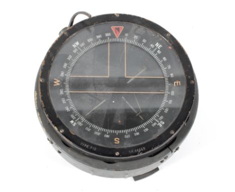 A type P10 military compass, stamped No. 44669, rotating and mounted on a grey painted metal base marked SA1671 18 cm diamete