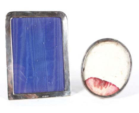 Two Victorian silver photo frames, the first of rectangular form, hallmarked Birmingham, 1898, the second of oval form, hallm