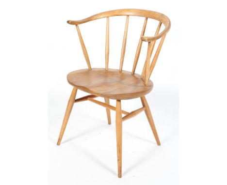An Ercol blonde elm and beech Windsor style armchair, with wishbone shaped back, on splayed legs, 76 cm high 