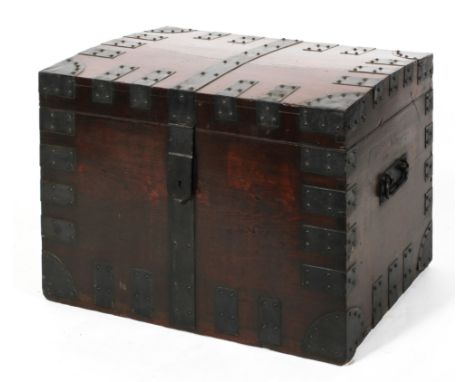 A Victorian metal bound trunk, probably camphour wood, the domed cover enclosing a vacant interior, 58cm high x 82cm wide x 5