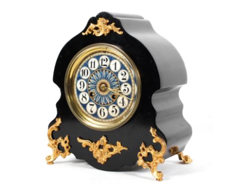 A Victorian mantel clock, the 4 3/4" ceramic dial on a brass movement striking to a bell, the ebonised case with gilt metal m