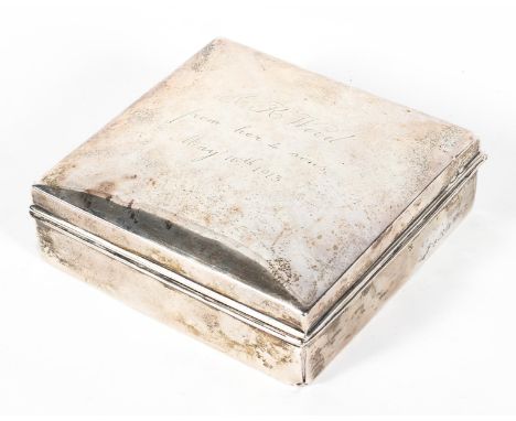 A silver cigarette box and hinged cover of square form, hallmarked for Birmingham, 1911, engraved with the inscription 'A. K.
