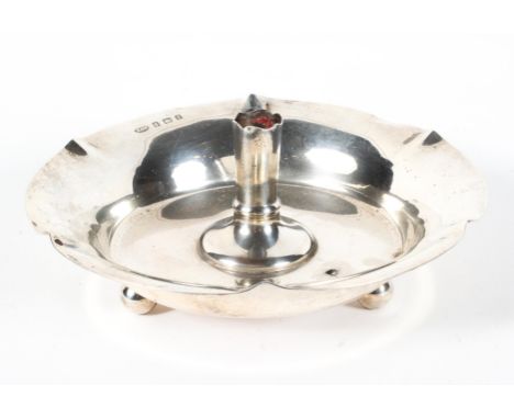 A silver candlestick holder, hallmarked for Birmingham, 1905, maker's mark for Norton &amp; White, with crimped rim and three