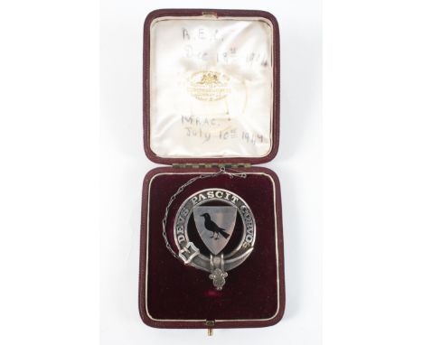 An early 20th century white metal Coat of Arms brooch, black enamel decoration to centre depicting a crow surrounded by the L