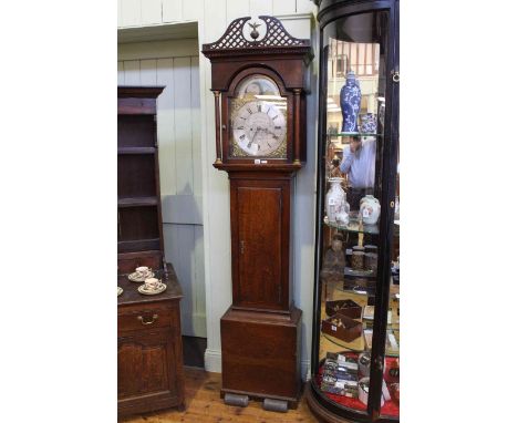 Antique oak eight day longcase clock having arched brass and silvered moon phase dial, signed Harrison, Newcastle.