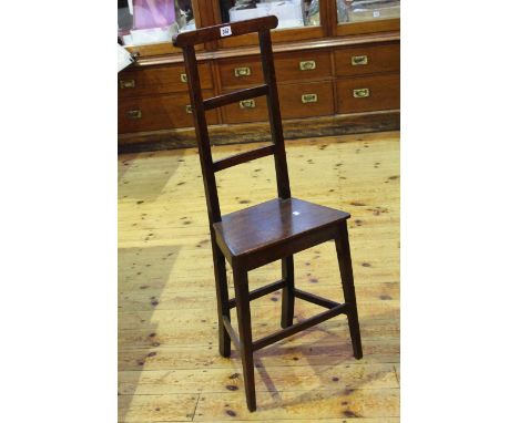 Early 19th Century mahogany ladder back child's correction chair.