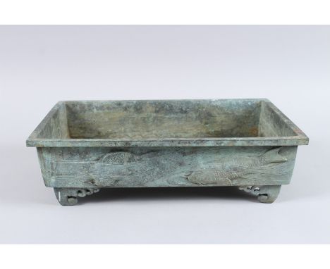 A BRONZE RECTANGULAR BONSAI PLANTER, the sides with fish in relief. 14ins long x 9ins wide x 4ins high, on bracket feet.
