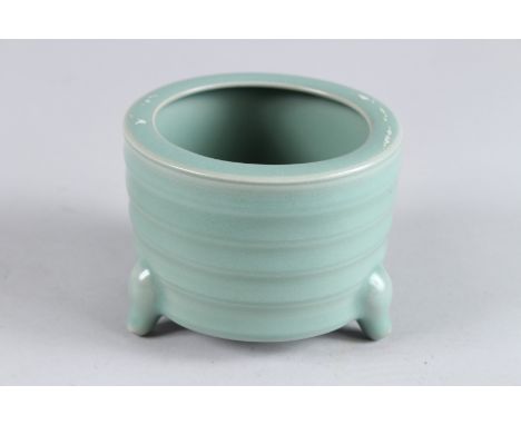 A CHINESE GREEN CELADON CIRCULAR BRUSH POT. 4ins diameter.