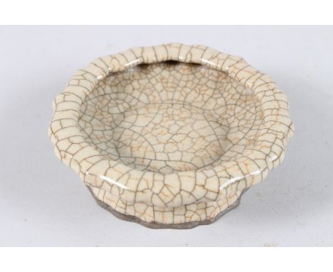 A CHINESE CRACKLE GLAZE POTTERY BRUSH WASHER of shaped form. 14cms diameter.