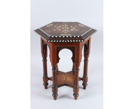 A SPANISH ISLAMIC OCTAGONAL INLAID TABLE with inlay and calligraphy. 18ins high x 14ins wide.