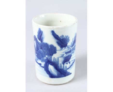A CHINESE BLUE AND WHITE CIRCULAR BRUSH POT with landscape design. 6.5ins high x 4.25ins diameter.