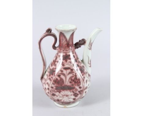 A CHINESE POTTERY EWER, painted with flowers in underglaze iron red. 20cms high.