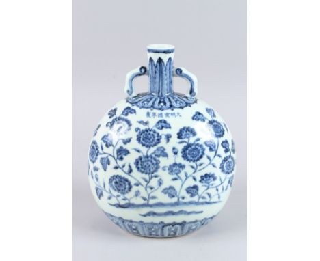 A GOOD CHINESE BLUE AND WHITE TWO HANDLED MOON FLASK decorated with flowers. Six character mark in blue. 10.5ins high.