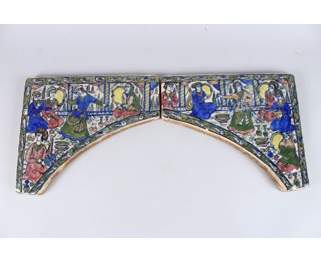 A FINE PERSIAN QAJAR GLAZED POTTERY ARCH TILES. 12ins x 17ins.