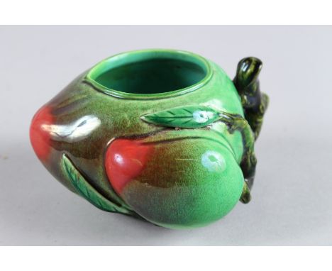 A CHINESE POTTERY PEACH BRUSH WASHER. 3ins high.