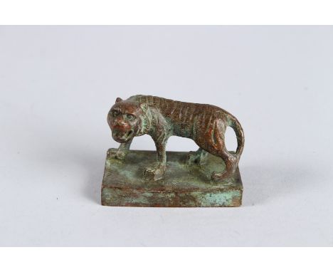 A CHINESE BRONZE TIGER SEAL on a rectangular base. 2.25ins x 1.25ins.