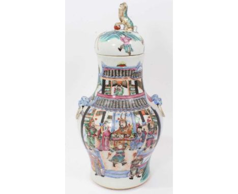 Chinese famille rose vase and cover, 19th century, of baluster form, with mask and ring handles, the cover with foo dog termi
