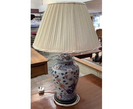 Chinese table lamp and shade, the porcelain base in the form of a jar and cover with Imari palette decoration and pleated sha