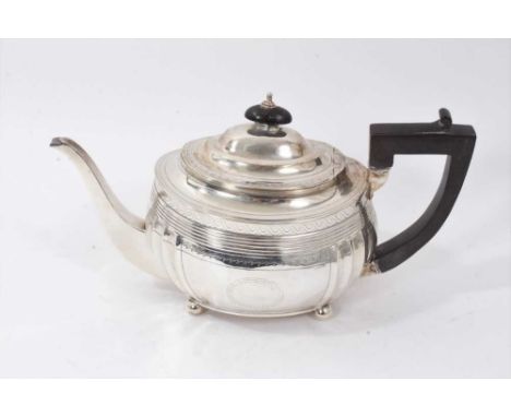 George III silver teapot of compressed baluster form, with fluted panels and bright cut decoration, oval domed cover and angu