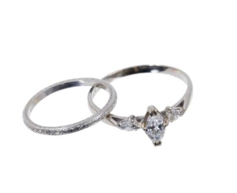 Diamond single stone ring with a marquise cut diamond estimated to weigh approximately 0.35cts flanked by a further marquise 